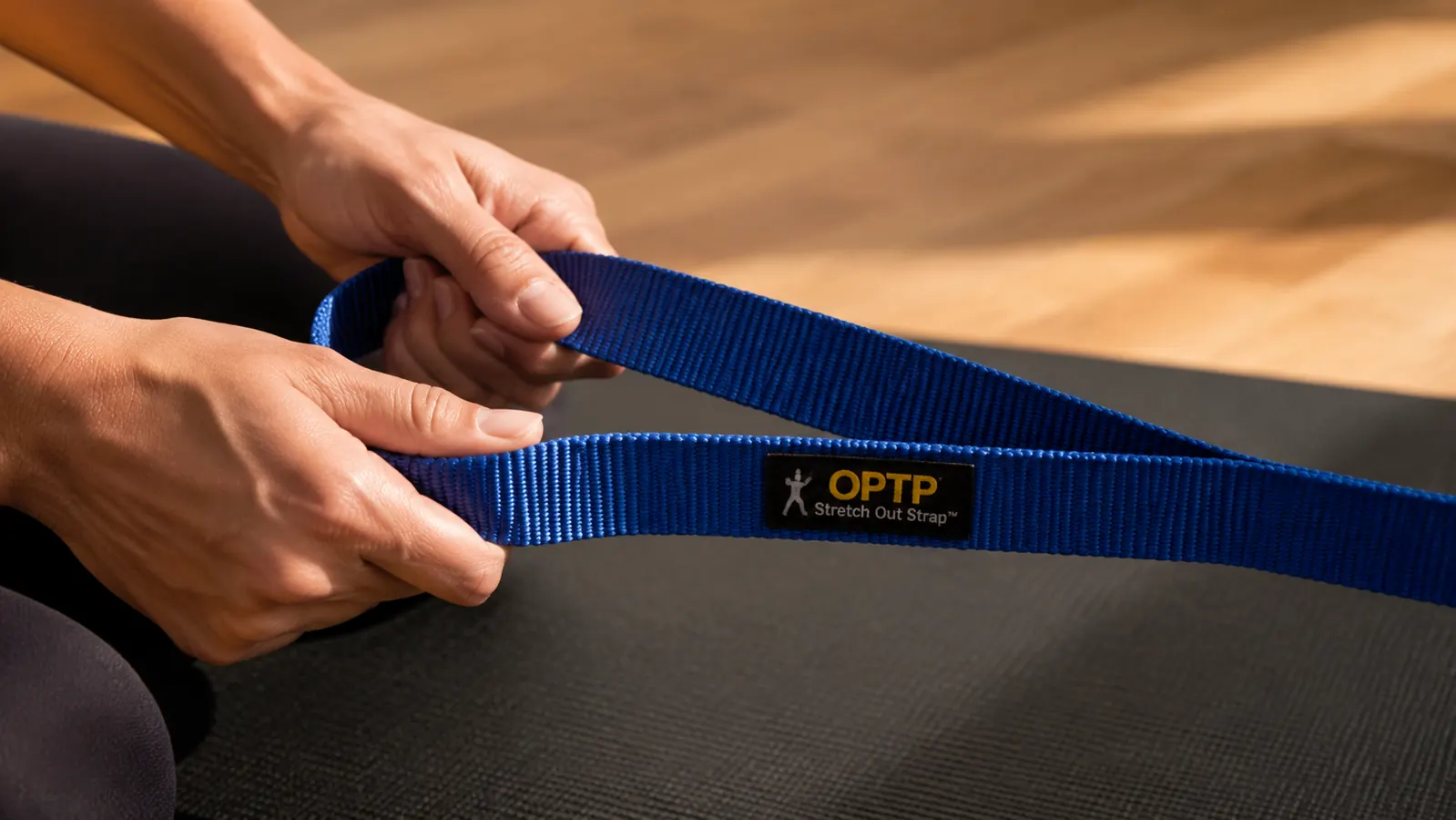 Close-up of the multiple loop rungs on the OPTP Stretch Out Strap showing the woven nylon construction